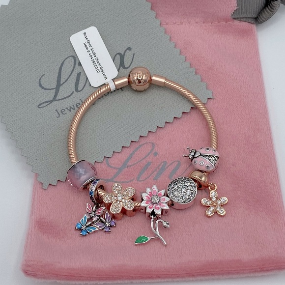 Linx Rose Gold Bracelet with Pink Rose Gold and Silver Themed Charms display picture 1